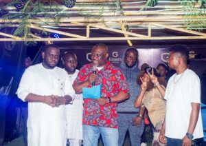 Chief of Staff to the Edo State governor Mr Osaigbovo Iyoha holding the document of land to be presented to the winner of the Clash of the Titans season 4 stage competition in Benin City