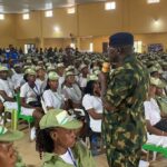 NYSC DG Ahmed addressing corps members at the Orientation Camp in Okada, Edo State
