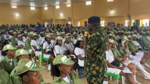 NYSC DG Ahmed addressing corps members at the Orientation Camp in Okada, Edo State
