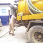A spectic tank disposal worker. Photo- GOGGLE