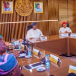 Akume in a meeting