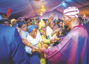 Gov Sanwo-Olu acknowledging cheers from retirees