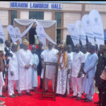 Management of Inter-Atlas Synergy Limited, led by Mr Peter Omoh Dunia, its Executive Director and School Management Board member of Ogbona Secondary School in a group photograph with the family of Late DIG Ibrahim Lamorde, during the commissioning of Ultra modern auditorium named in his honour in Edo State over the weekend