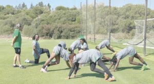 • Coach Waldrum supervises another training session.