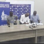 • Finidi George signing the contract document, yesterday, in Port Harcourt