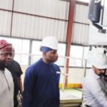 •MD of LSM, Taiwo Shittu (left) taking the NADDC DG, Joseph Osanipin, through the assembly line