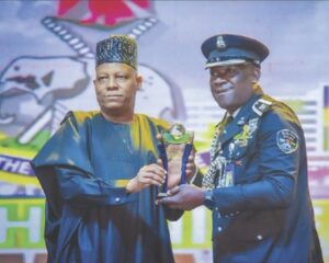 •Shaba being presented the award by Vice President Shettima