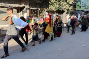 Displaced Palestinians flee in Deir Al-Balah