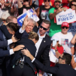 Former US President escorted off stage by secret service agents after failed assassination attempt at a Pennsylvania rally, July 13, 2024