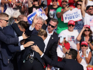 Former US President escorted off stage by secret service agents after failed assassination attempt at a Pennsylvania rally, July 13, 2024