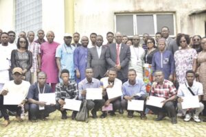 Dr. Owolabi flanked by FUTA officals, students and guests photograph