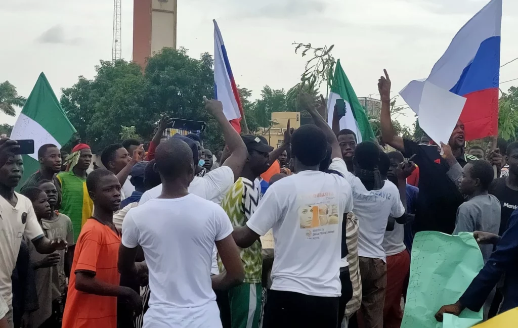 Nigerians waving Russian flag