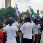 Nigerians waving Russian flag