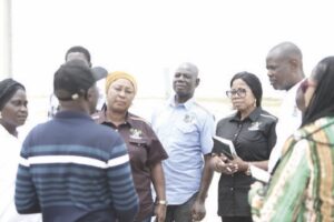 •The shipping firm official and the state government officials discussing at the scene of the incident