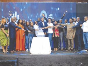 Organisers of the event cutting the anniversary cake with guests