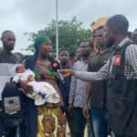 Nursing mother protests in Abuja