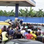A crowd at a filling station