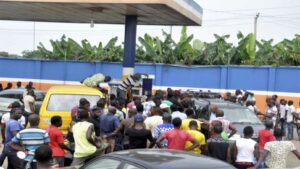 A crowd at a filling station