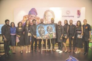 Francis Jide (fifth from left) with team members of VisionSpring in a group photograph, where he displayed the artwork he drew at the venue