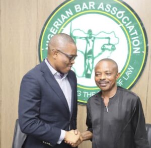 L-R: President, Nigeria Bar Association (NBA), Afam Osigwe, SAN, in a handshake with Nigeria Labour Congress (NLC) president, Joe Ajaero, when the NLC visited the NBA office in Abuja, on Thursday