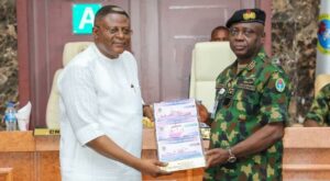 Cross River State Governor, Senator Bassey Otu (left), with Chief of Naval Staff, Rear Admiral Ogalla, during a visit to CNS’s office in Abuja.