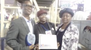 •Bolaji (m) flanked by her parents