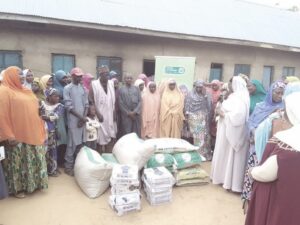 •IDPs at Malado IDPs receiving food items from Hajiya Nasir Idris