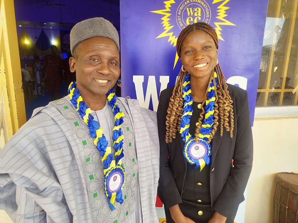 WAEC Head of National Office, Dr. Amos Dangut and best overall WASSCE student, Whiskey Orevaoghene at the award event in Kaduna