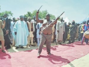 A Tauri dancer slicing his stomach with a cutlass
