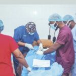 Medical doctors performing a surgery during the outreach