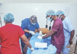 Medical doctors performing a surgery during the outreach