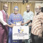 Mrs. AbdulKarim-Yusuf (middle) presenting the cheque at the event