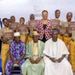 Uwadoka (middle), traditional rules and students