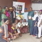 • Edukugho (5th right) with members of the foundation, teachers and pupils at the event