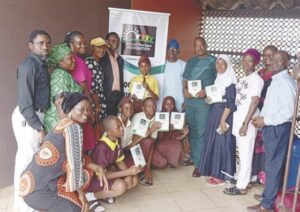 • Edukugho (5th right) with members of the foundation, teachers and pupils at the event