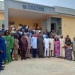 Group photograph outdoors in front of TetFund office