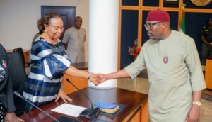 Rivers Governor Siminalayi Fubara (right) in a handshake with the Chairperson of the Judicial Commission of Inquiry into the Arson, Killings and Wanton Destruction of Property in Local Government Councils, Justice Ibiwengi Roseline Minakiri (right); shortly after receiving reports of the commission at Government House in Port Harcourt on Tuesday