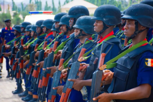 NSCDC officers on parage, holding rifles