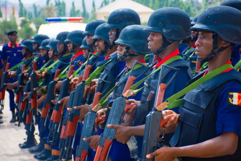 NSCDC officers on parage, holding rifles
