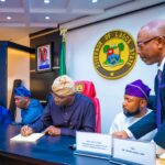 Lagos State Governor Babajide Sanwo-Olu signing bill