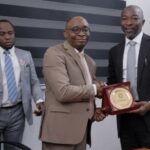 MD:CE NSITF Oluwaseun Faleye presenting a plaque to the Director General of the BPP, Adebowale Adedokun during a courtesy visit in Abuja