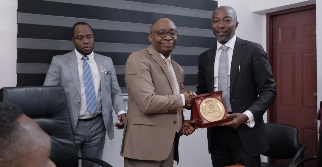 MD:CE NSITF Oluwaseun Faleye presenting a plaque to the Director General of the BPP, Adebowale Adedokun during a courtesy visit in Abuja