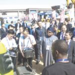Nigerian and Chinese dignitaries inspect expo display grounds to declare event open.