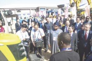 Nigerian and Chinese dignitaries inspect expo display grounds to declare event open.