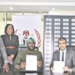 Olugbile (3rd left) with Darwish (2nd right) after signing the agreement