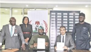 Olugbile (3rd left) with Darwish (2nd right) after signing the agreement