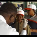 One of the beneficiaries going through an eye test