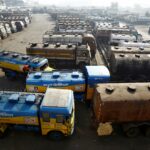 FILE PHOTO: Oil tankers are seen parked at a yard outside a fuel depot on the outskirts of Kolkata