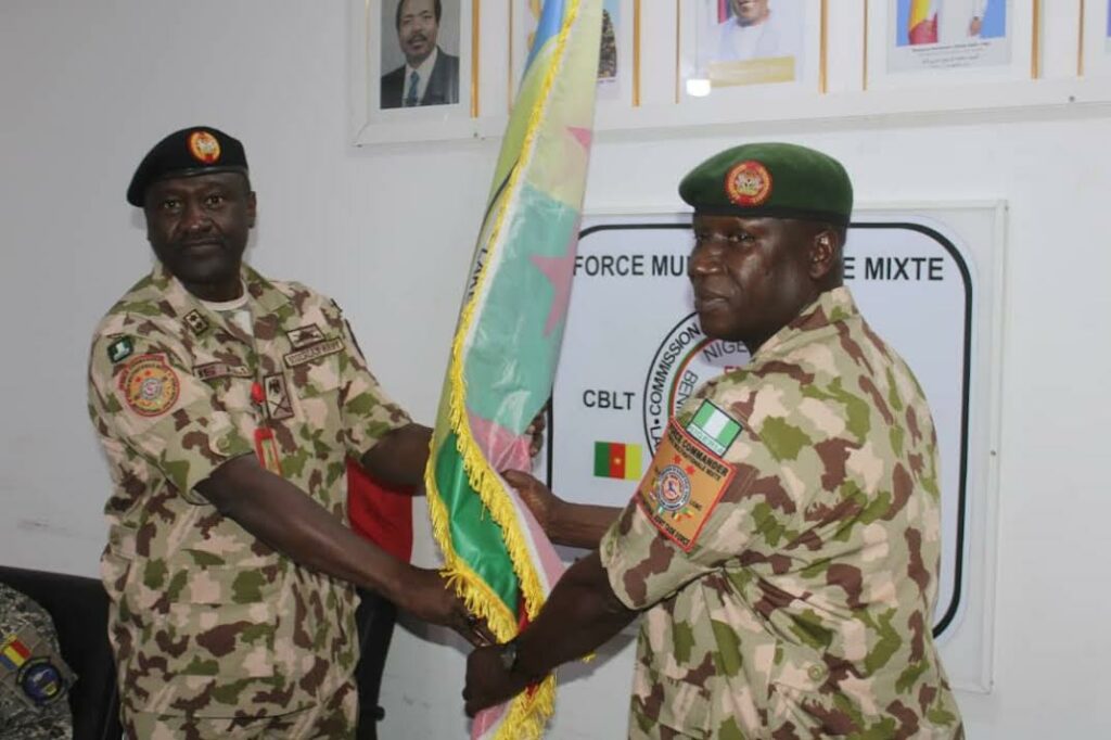 Maj Gen Godwin Mutkut receives the MNJTF flag from his predecessor, Maj Gen Ibrahim Ali, during the handing-over ceremony on Thursday, January 23, 2025