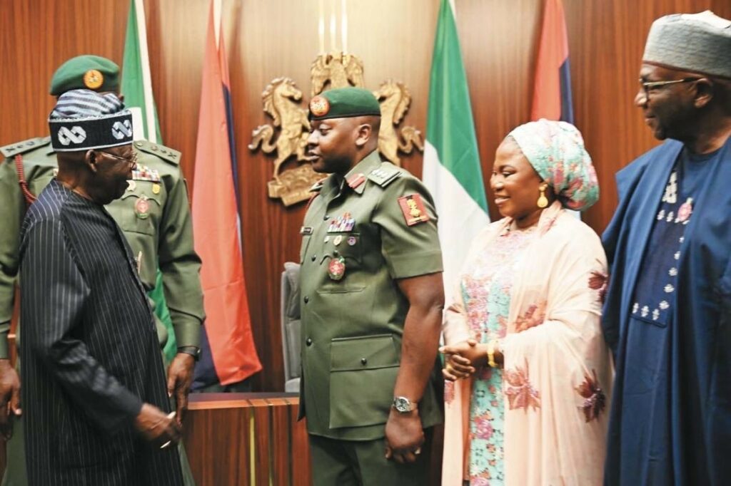 President Bola Tinubu, his ADC, Col. Nurudeen Yusuf, his wife, Ganiyat Yusuf and Chairman of Nigeria Governors Forum (NGF) and Governor of Kwara State, AbdulRahman AbdulRazaq, at the brief ceremony at the State House, Abuja